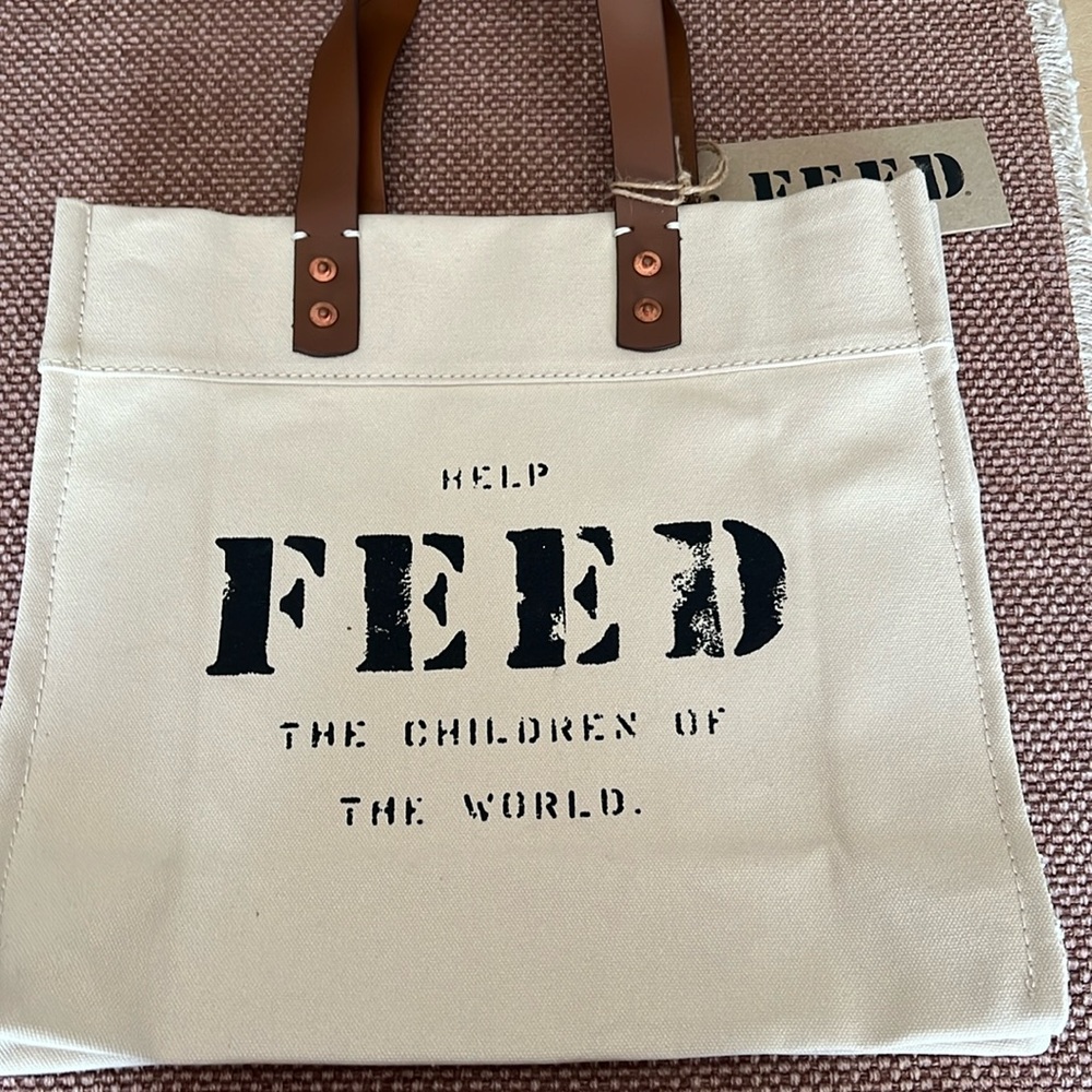 Small FEED Market tote. Sturdy with tag.